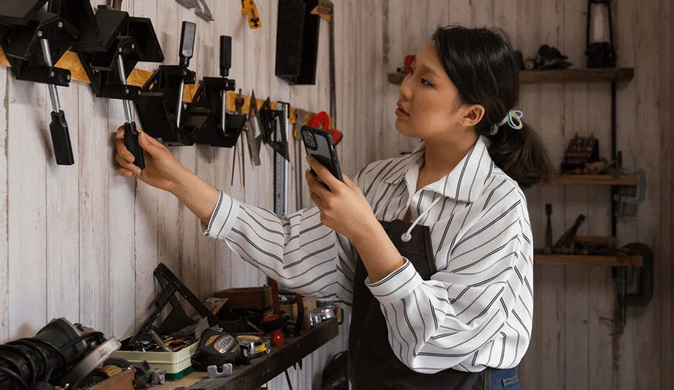 Woman selecting industrial tools for her work.